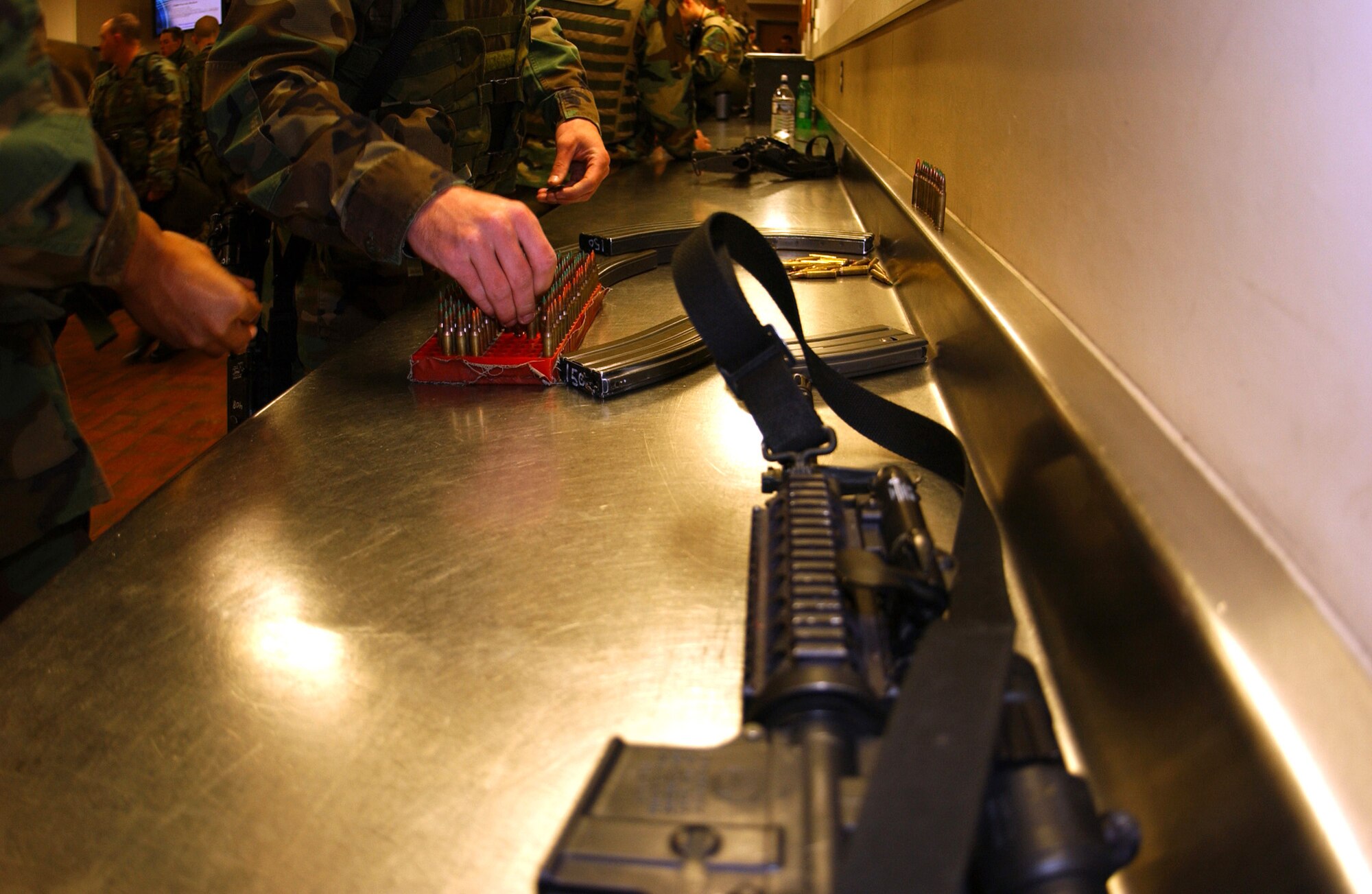 Airmen from the 5th Security Forces Squadron at Minot Air Force Base, N.D., block their ammunition after their shift Friday, April 21, 2006. This procedure ensures accountability for all issued ammunition. (U.S. Air Force photo/Staff Sgt. Jocelyn Rich)