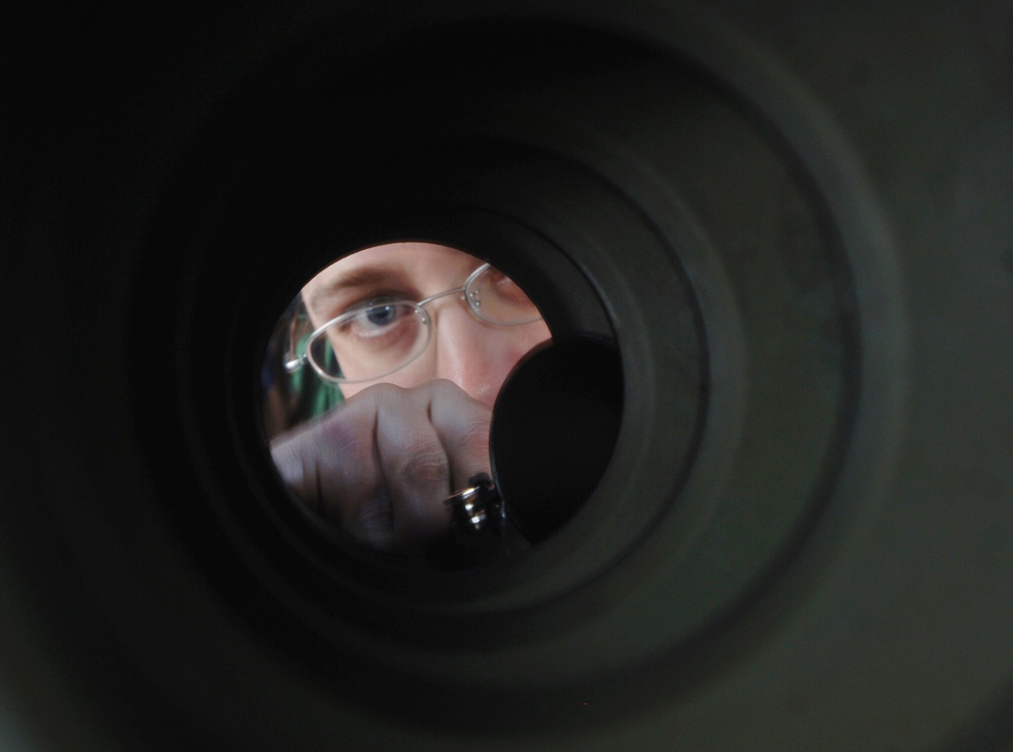 Staff Sgt. Jason Barefield uses a mirror to check for corrosion, deformities and broken rivets inside a C-130 Hercules wing panel during an inspection at Yokota Air Base, Japan, on Tuesday, April 25, 2006. Sergeant Barefield is an aircraft mechanic with the 374th Maintenance Squadron. (U.S. Air Force photo/Val Gempis) 
