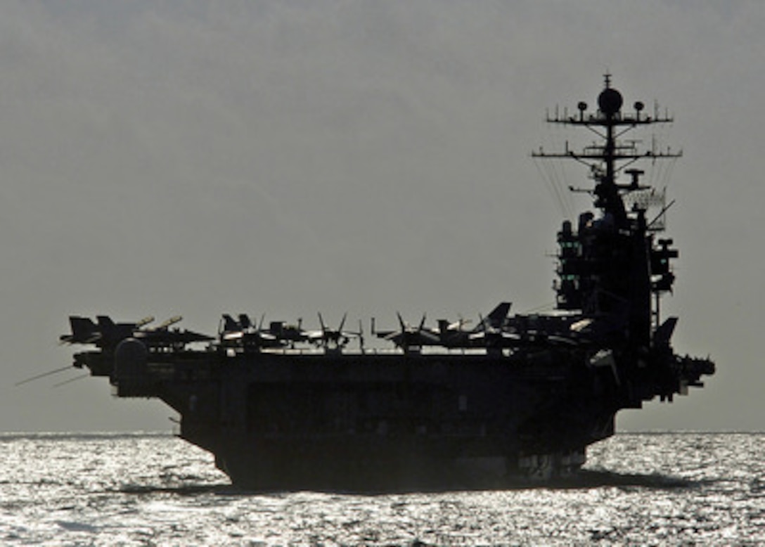 The aircraft carrier USS George Washington (CVN 73) prepares to conduct a refueling at sea with the guided missile cruiser USS Monterey (CG 61) as the two ships operate in the Caribbean Sea on April 20, 2006. The George Washington Carrier Strike group is participating in Partnership of the Americas, a maritime training and readiness deployment of U.S. Naval Forces along with navies of Caribbean and Latin American countries for enhanced maritime security. 