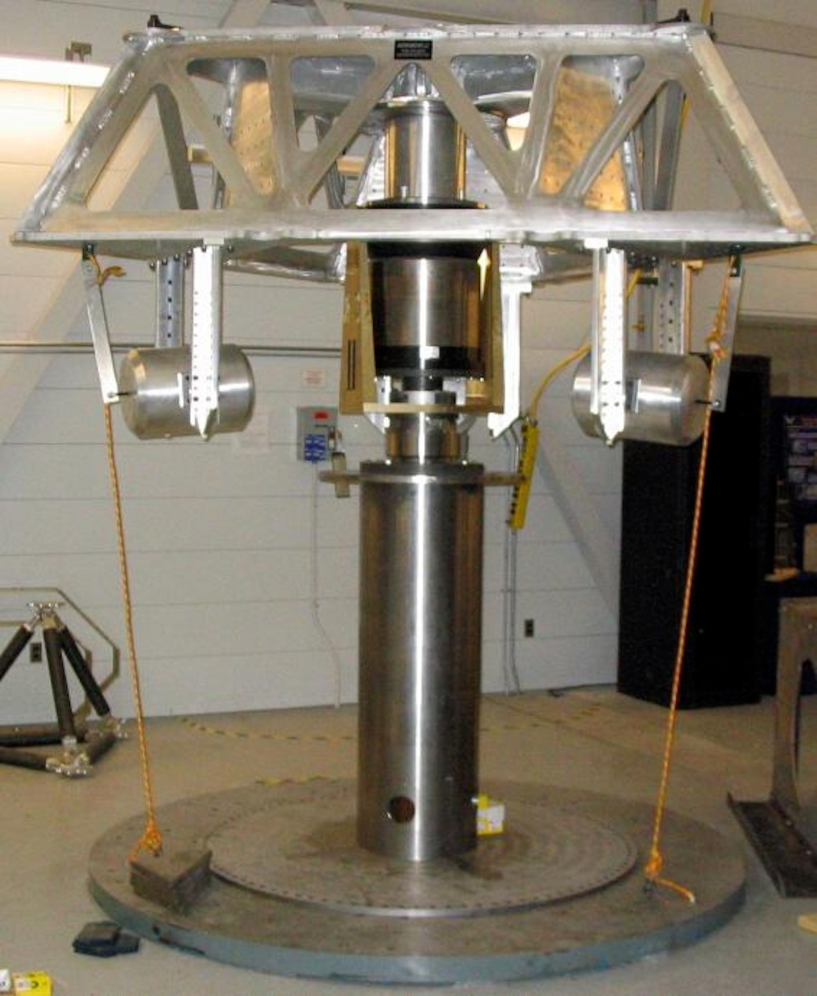 KIRTLAND AIR FORCE BASE, N.M. — A completed mini-Agile Multi-Purpose Satellite Simulator displaying three flywheel mass simulators that spin between 16,000 and 40,000 revolutions per minute.  The Space Vehicles Directorate here hopes to demonstrate the innovative technology of combined attitude control and energy storage on a satellite. (Air Force Photo) 

