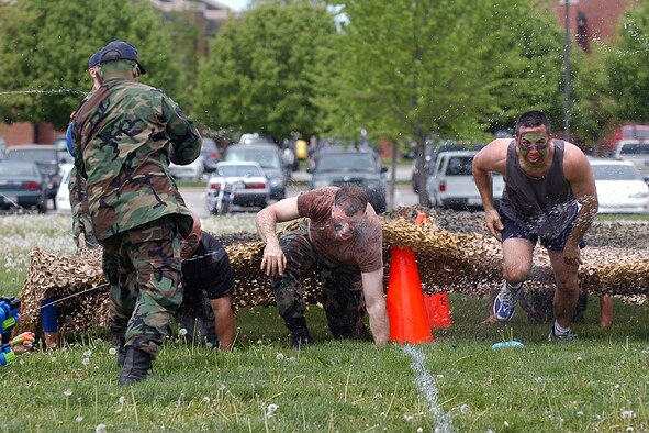 Members of the 375th Mission Support Group compete in the low crawl portion of the combat relay during the group's Combat Field Day on April 21, 2006.