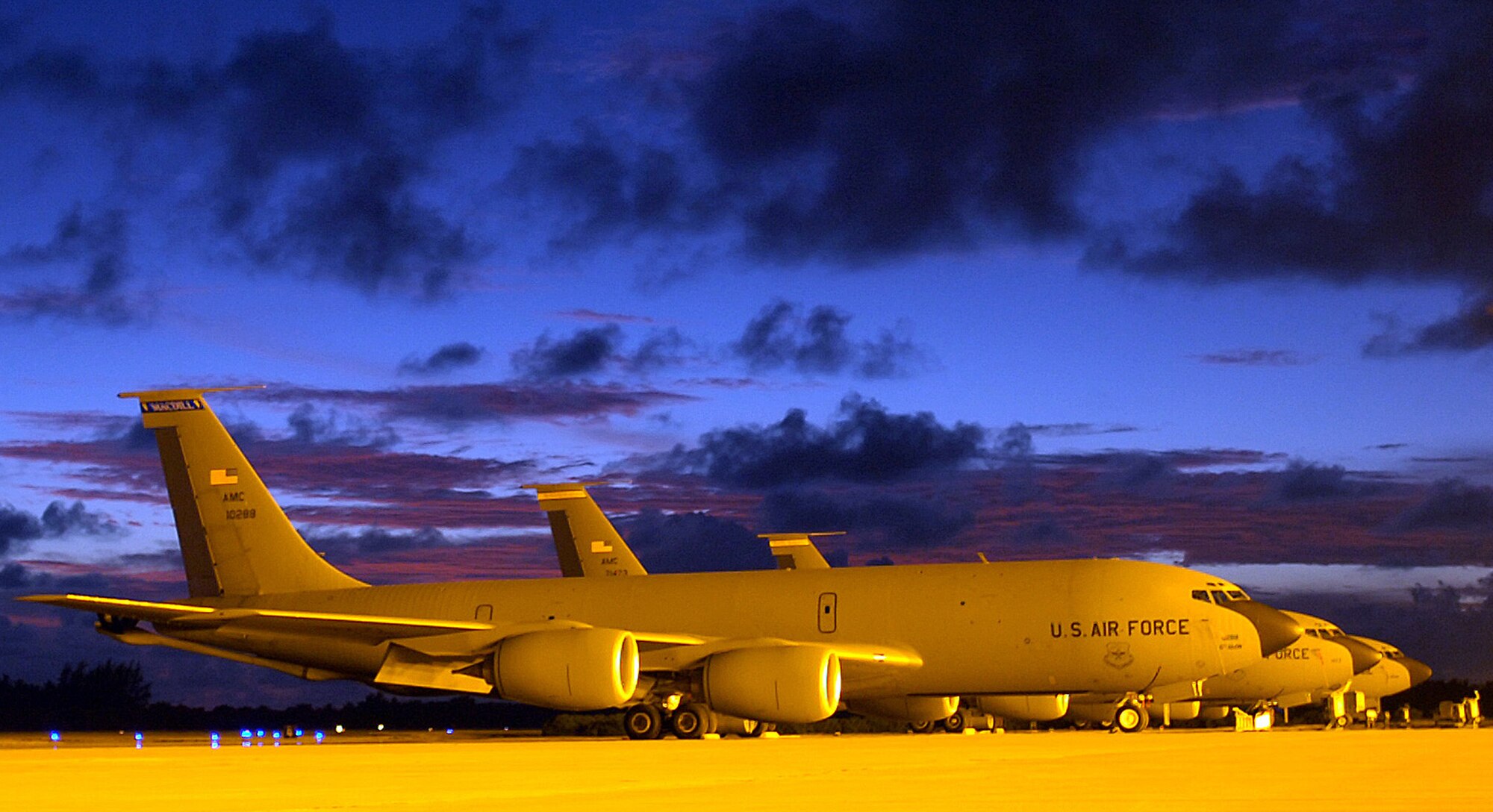 These KC-135 Stratotankers parked on the ramp of a forward operating location Sunday, April 23, 2006, provide fuel to B-52 Stratofortresses that fly in support of Operation Enduring Freedom. The 40th Air Expeditionary Group safety office here manages the bird aircraft strike hazard program, eliminating that threat so that aircraft can complete their combat missions. (U.S. Air Force photo/Senior Master Sgt. John Rohrer) 
