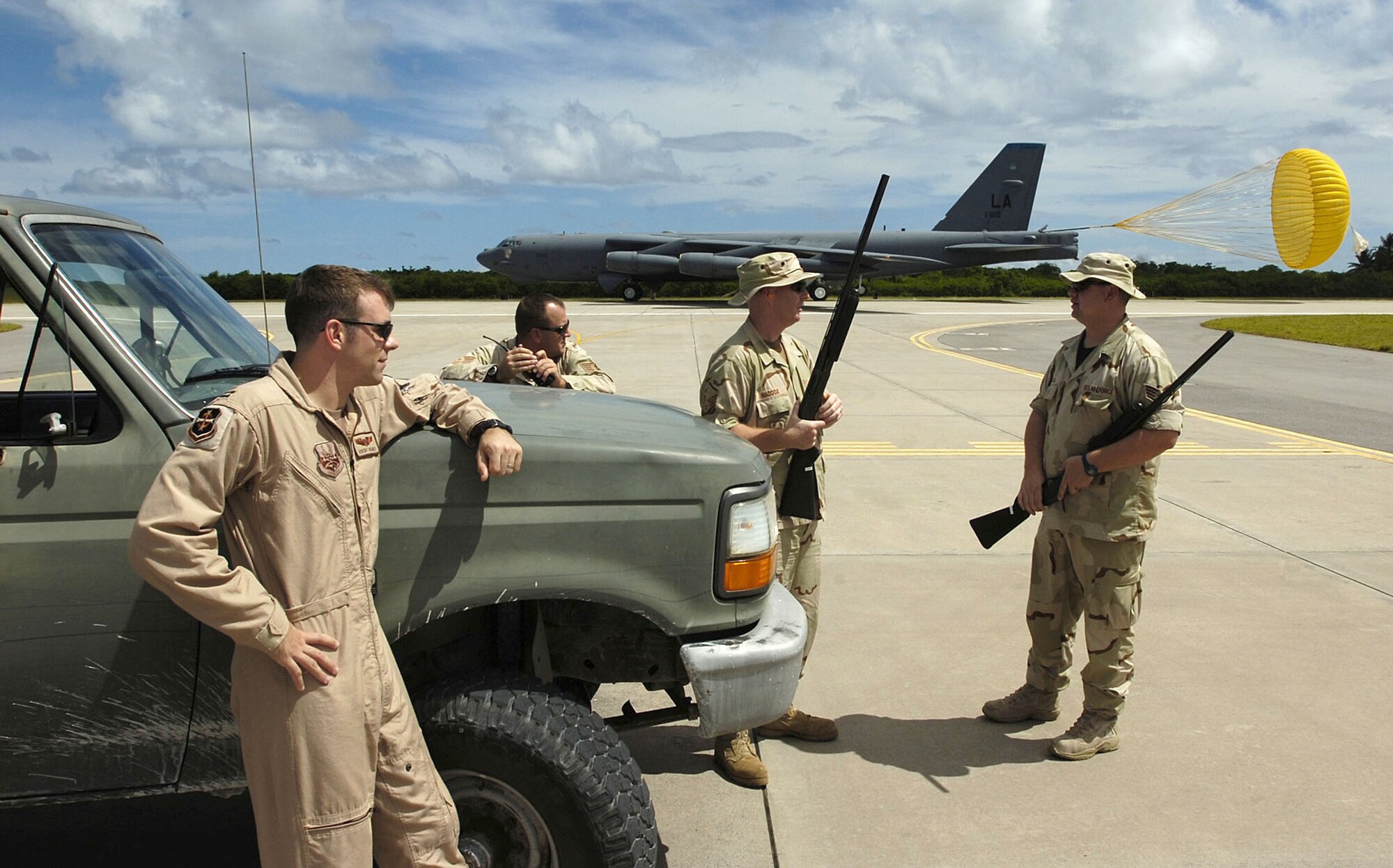 (Left to right) Capt. Jeremy Homes, Tech. Sgt. Roy Ollie, Master Sgt. Joe Haddox and Staff Sgt. Jason Bamberg watch for birds as a B-52 Stratofortress lands after a combat mission over Afghanistan on Wednesday, April 26, 2006. The four Airmen are assigned to the 40th Air Expeditionary Group safety office. (U.S. Air Force photo/Senior Master Sgt. John Rohrer)