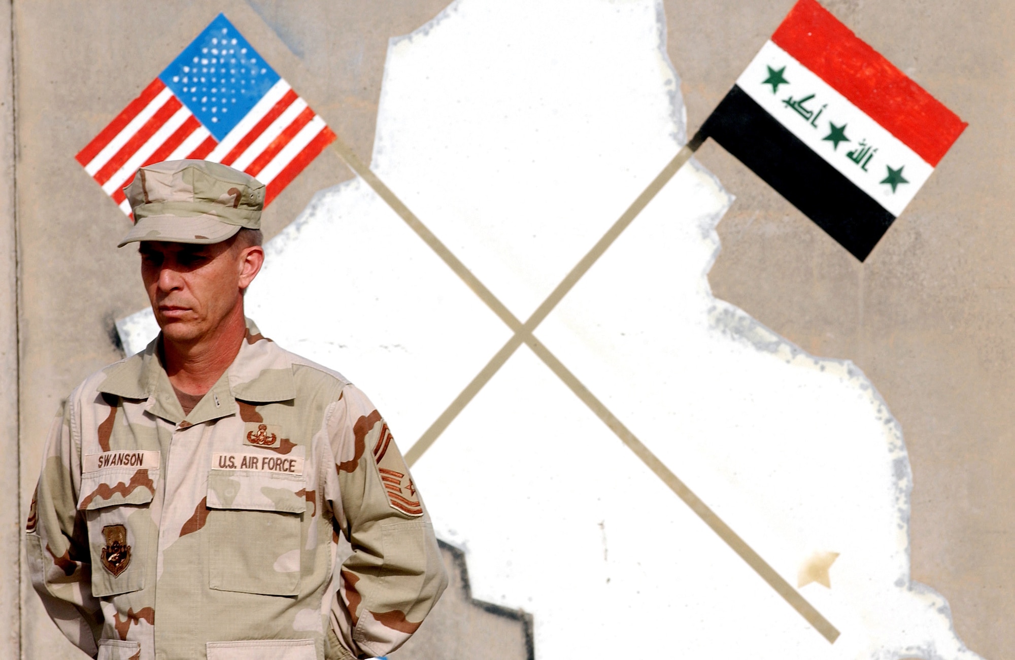 Senior Master Sgt. Jeffrey Swanson stands at rest during a recognition ceremony for the Fallen Airman Memorial on Wednesday, April 26, 2006, at Ali Base, Iraq. Sergeant Swanson is assigned to the 407th Expeditionary Civil Engineer Squadron. (U.S. Air Force photo/Staff Sgt. Bradley C. Church)