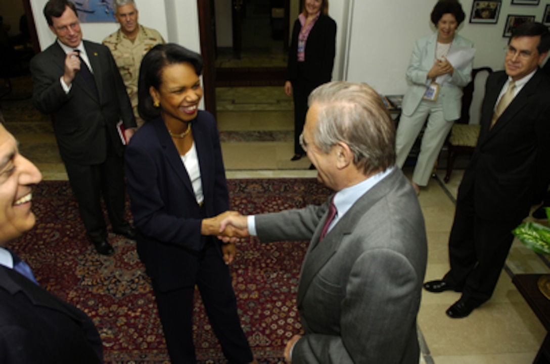 Secretary of Defense Donald H. Rumsfeld greets Secretary of State Condoleezza Rice in Baghdad, Iraq, on April 26, 2006. Rumsfeld and Rice made an unannounced visit to Iraq to meet jointly with Iraq's newly designated Prime Minister Jawad al-Maliki to show support for the continuing process of building a new Iraqi government. Rumsfeld earlier met with Commanding General, Multi-National Force Iraq Gen. George Casey Jr. 