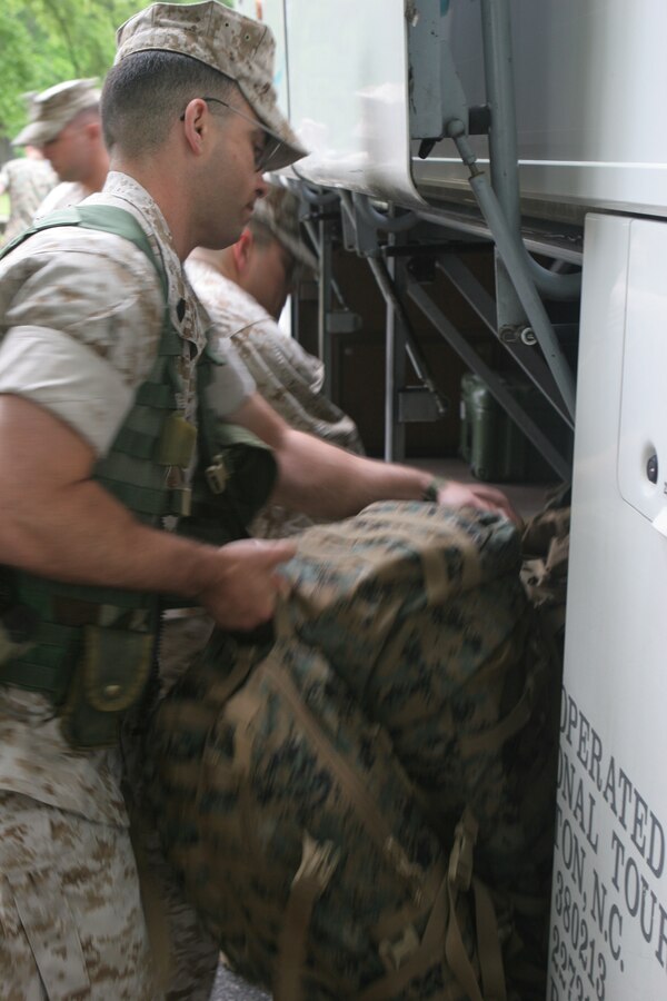 Marines with the 24th Marine Expeditionary Unit?s Command Element load packs aboard a Norfolk-bound bus on April 28, 2006. 24th MEU Marines will be participating in a Certification Exercise with the Navy aboard the USS Iwo Jima.