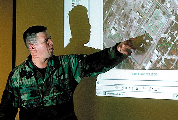 Master Sgt. Dean Larson, 442nd Civil Engineer Squadron, delivers a briefing to fellow 442nd CES members at a deployed location. Sergeant Larson  represented 10th Air Force in the Air Force Reserve Command's Outstanding Airman of the Year competition at Robins Air Force Base, Ga. (Photo by Master Sgt. Bill Huntington)
