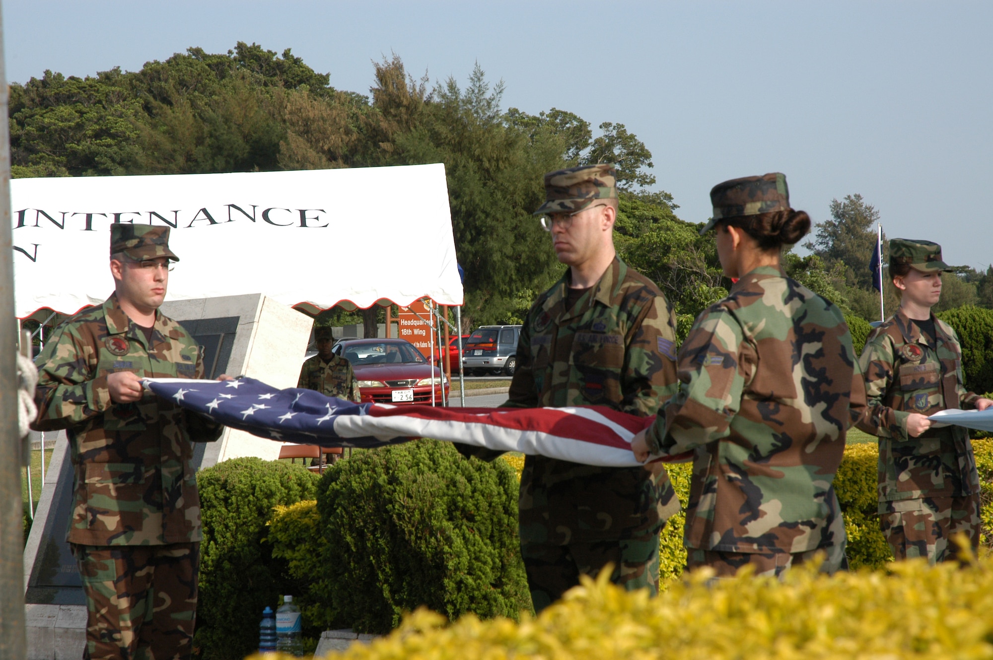 Members of Kadena's Honor Guard fold the flag during a retreat ceremony held on base April 21.  The 353rd Special Operations Group held the ceremony to honor eight service members killed during Operation Eagle Claw April 24, 1980.                                