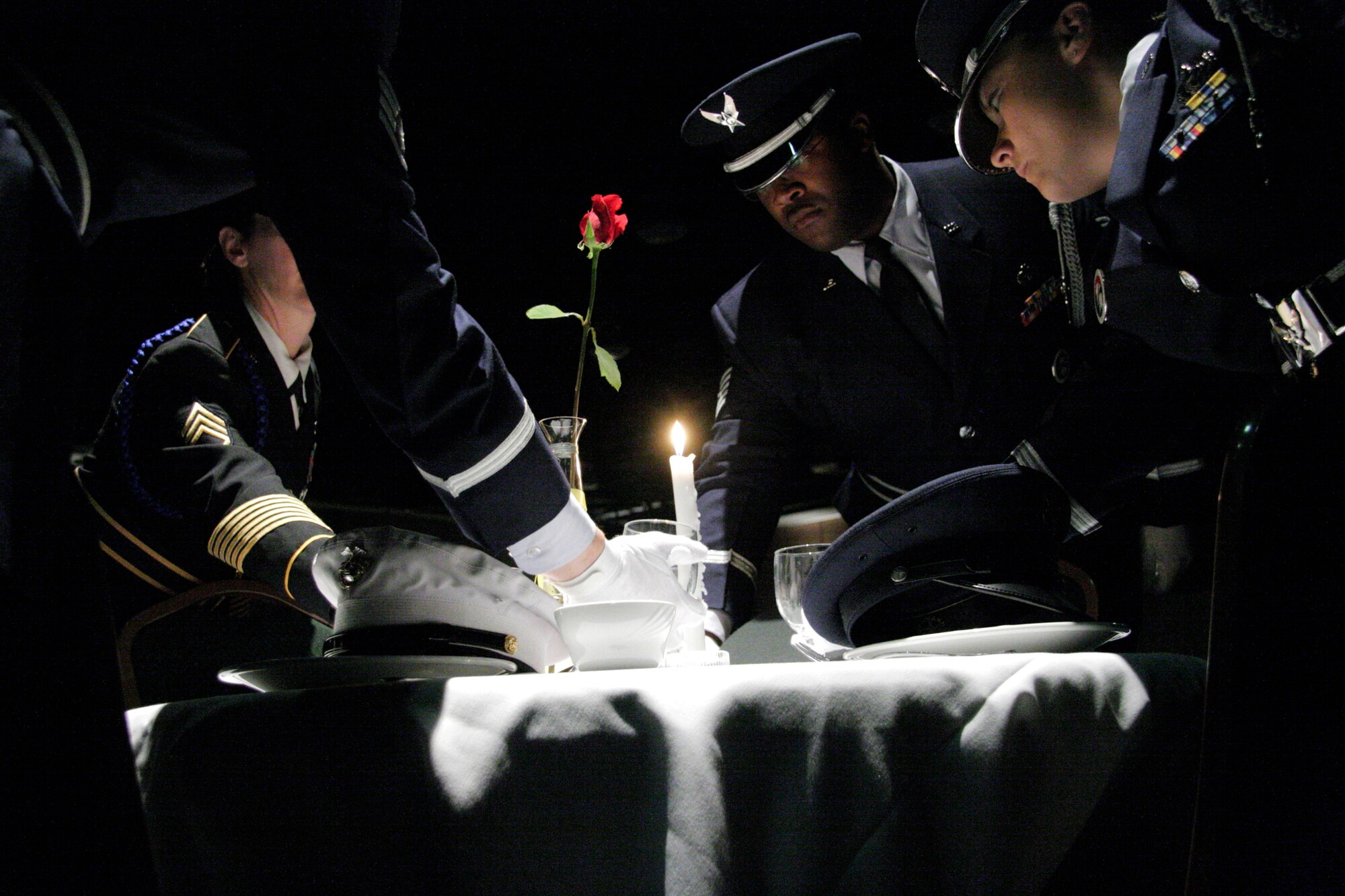 Members of the Governor's Color Guard perform the POW/MIA ceremony during the National Guard Association of Oklahoma's Military Ball in Oklahoma City on Saturday, April 22, 2006. More than 500 people attended the annual event. (U.S. Air Force photo/Tech. Sgt. Mark Moore)