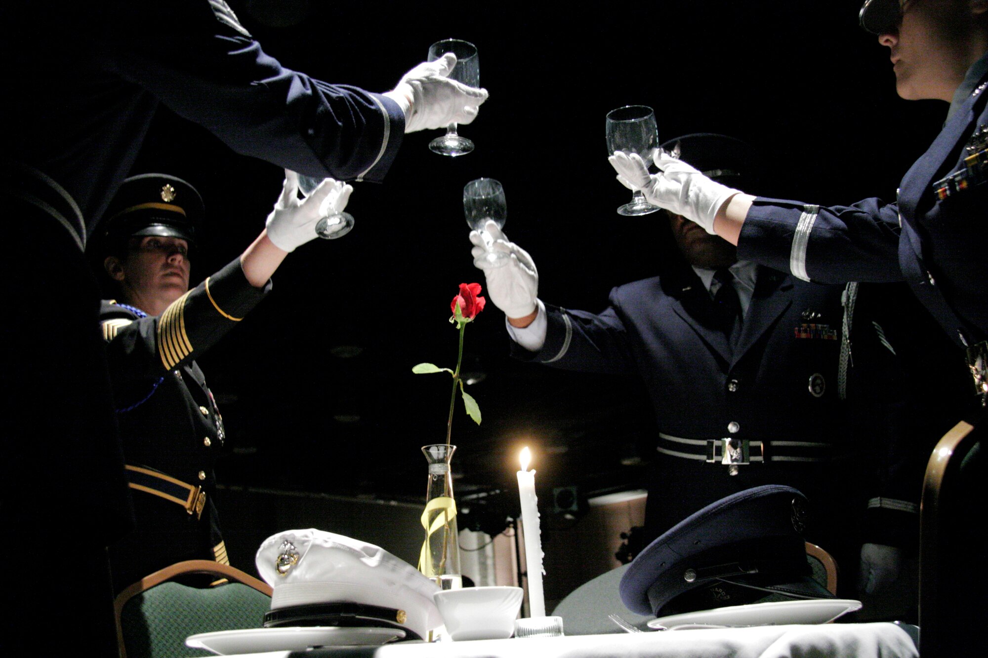 Members of the Governor's Color Guard perform the POW/MIA ceremony during the National Guard Association of Oklahoma's Military Ball in Oklahoma City on Saturday, April 22, 2006. More than 500 people attended the annual event. (U.S. Air Force photo/Tech. Sgt. Mark Moore)