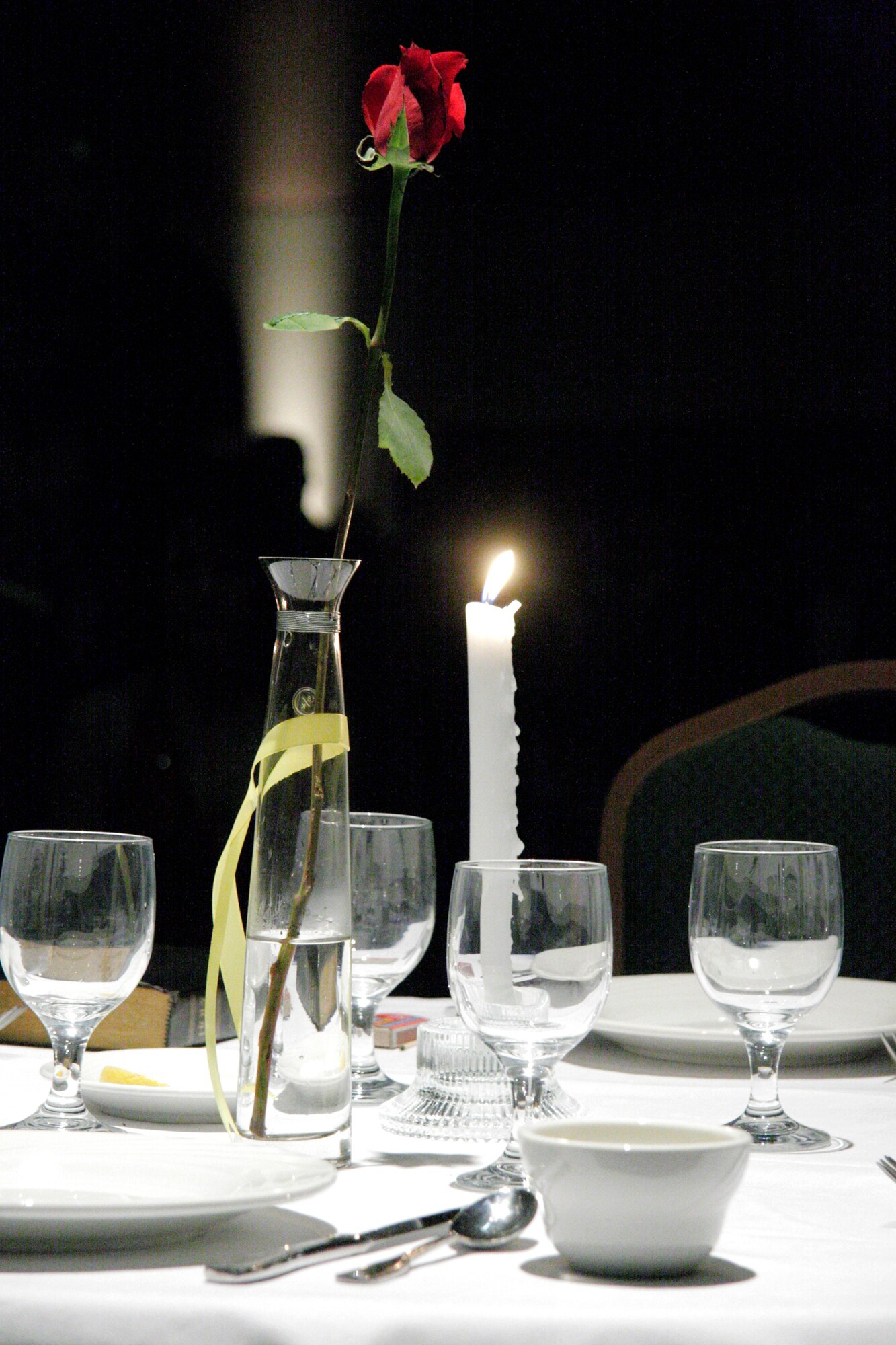 The POW/MIA table sits front and center at the National Guard Associaton of Oklahoma's Military Ball in Oklahoma City on Saturday, April 22, 2006. This table is set for our prisoners of war and those missing in action, from all wars. The table remains empty in hopes of their return. More than 500 people attended the annual event. (U.S. Air Force photo/Tech. Sgt. Mark Moore)