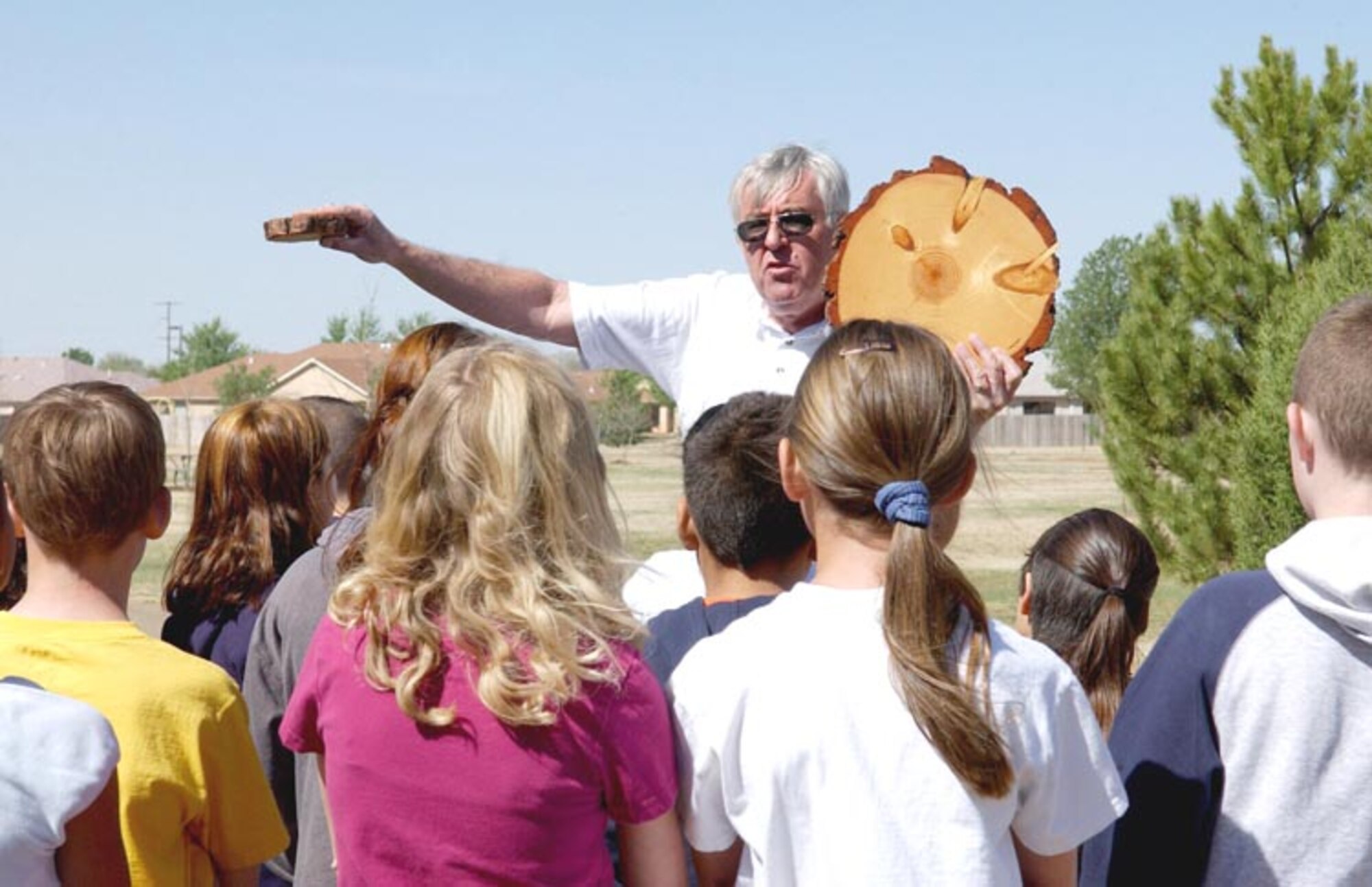 CANNON AIR FORCE BASE, N.M. - George Duda, an urban forester for New Mexico State Forestry, explains the life cycle of a tree to Ranchvale Elementary School students during an Earth Day presentation April 19. (U.S. Air Force photo by Airman 1st Class Brian Ellis)