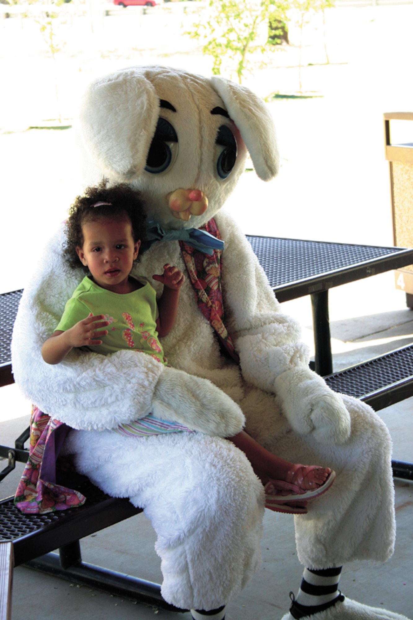CANNON AIR FORCE BASE, N.M. - Kyana Burney, age 22 months, sits with the Easter Bunny during the 27th Medical Group’s annual Easter egg hunt April 14 at Unity Park. Families of the 27th Medical Group were invited out from 11 a.m. to 1 p.m. for a variety of Easter related activities. (U.S. Air Force photo by Staff Sgt. Craig Seals)