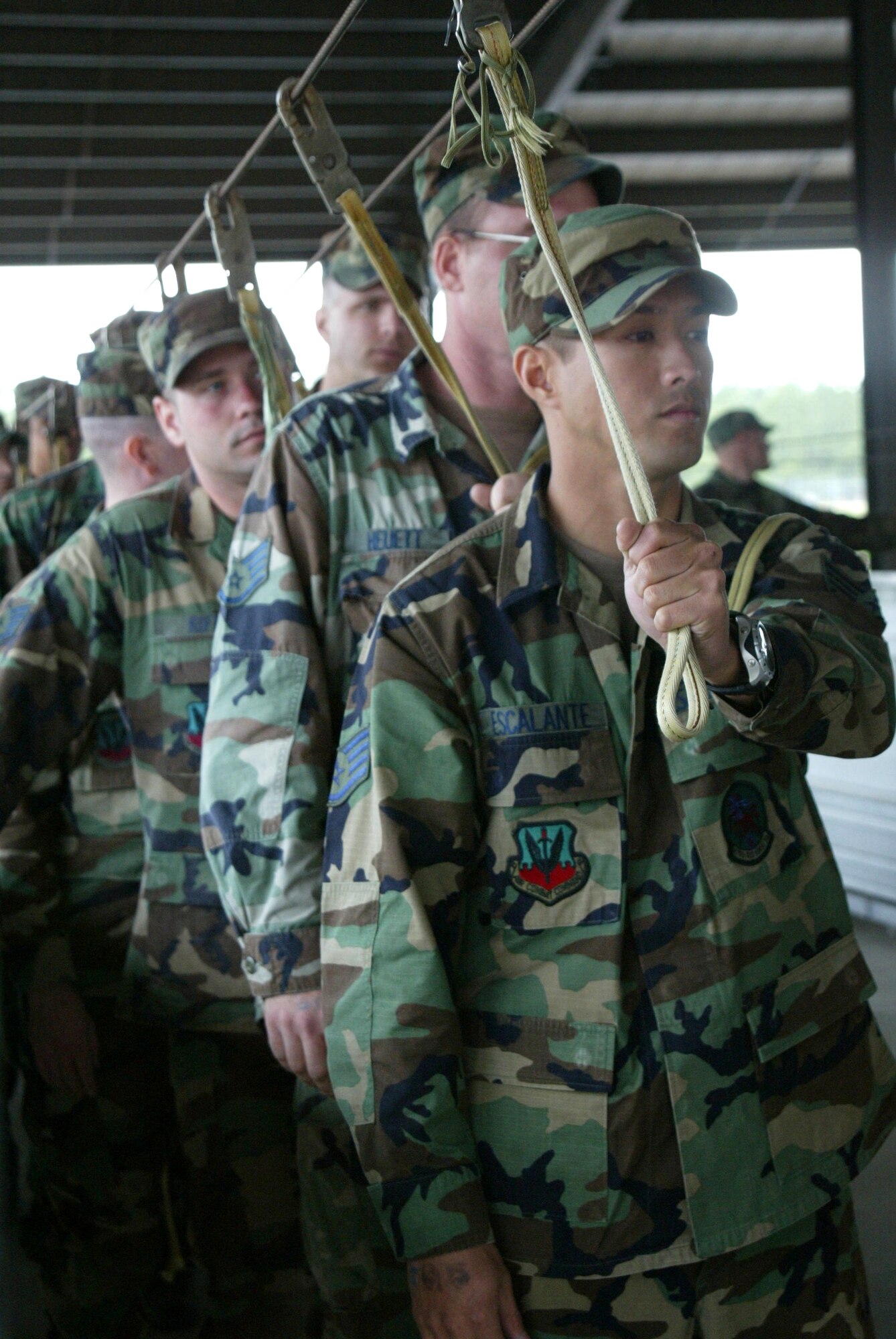 Airmen walk through a sustained airborne training session on Friday, April 21, 2006 before participating in a Joint Forced Entry Exercise at Pope Air Force Base, N.C. They are part of an airborne Red Horse unit training with the Army's 82nd Airborne Division. (U.S. Air Force photo/Lisa Terry McKeown)
