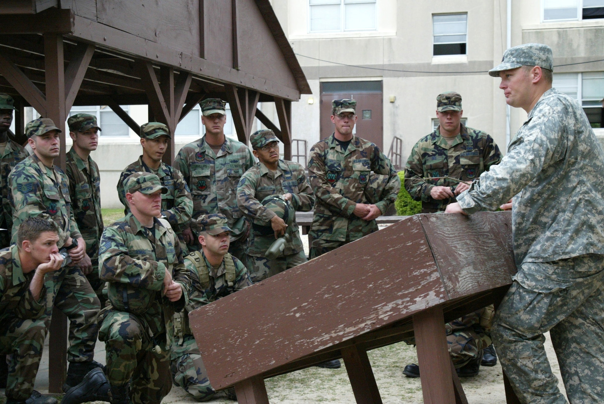 Capt. Brent Legreid briefs members of his team while preparing for a Joint Forced Entry Exercise with the Army's 82nd Airborne Division at Pope Air Force Base, N.C., on Saturday, April 22, 2006. Captain Legreid is the airborne Red Horse project manager. (U.S. Air Force photo/Lisa Terry McKeown)
