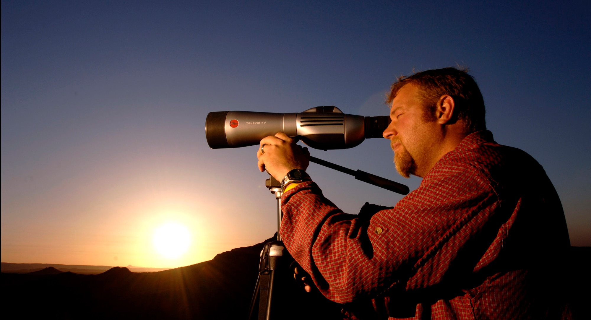 Erik Stenehjem conducts routine pronghorn clearance at the Barry M. Goldwater Range in Phoenix, Ariz., at 4:30 a.m. Monday, April 24, 2006. Once no sign of the pronghorn antelope is found, mission bombings and strafing can continue on the range. Mr. Stenehjem is the lead biologist for pronghorn monitoring. (U.S. Air Force photo/Tech. Sgt. Cecilio M. Ricardo Jr.)