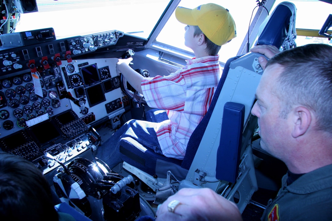 Lt. Col. Brian Calkins explains the instrument panel of a KC-135 Stratotanker to Cheis Hanzelic during Take Our Daughters and Sons to Work Day at the 939th Air Refueling Wing in Portland, Ore., on Thursday, April 27, 2006. Colonel Calkins is assigned to the 64th Air Refueling Wing. (U.S. Air Force photo/Ruby Zarzyczny)