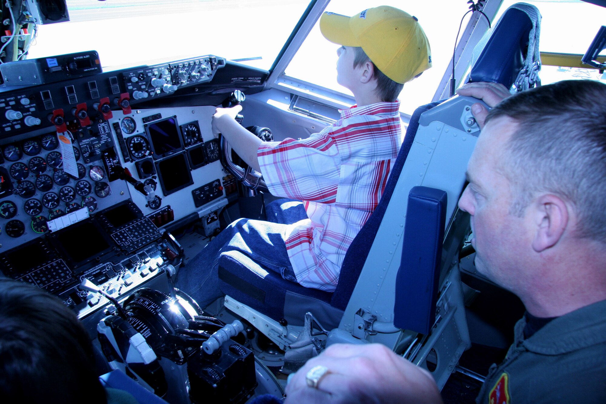 Lt. Col. Brian Calkins explains the instrument panel of a KC-135 Stratotanker to Cheis Hanzelic during Take Our Daughters and Sons to Work Day at the 939th Air Refueling Wing in Portland, Ore., on Thursday, April 27, 2006. Colonel Calkins is assigned to the 64th Air Refueling Wing. (U.S. Air Force photo/Ruby Zarzyczny)

