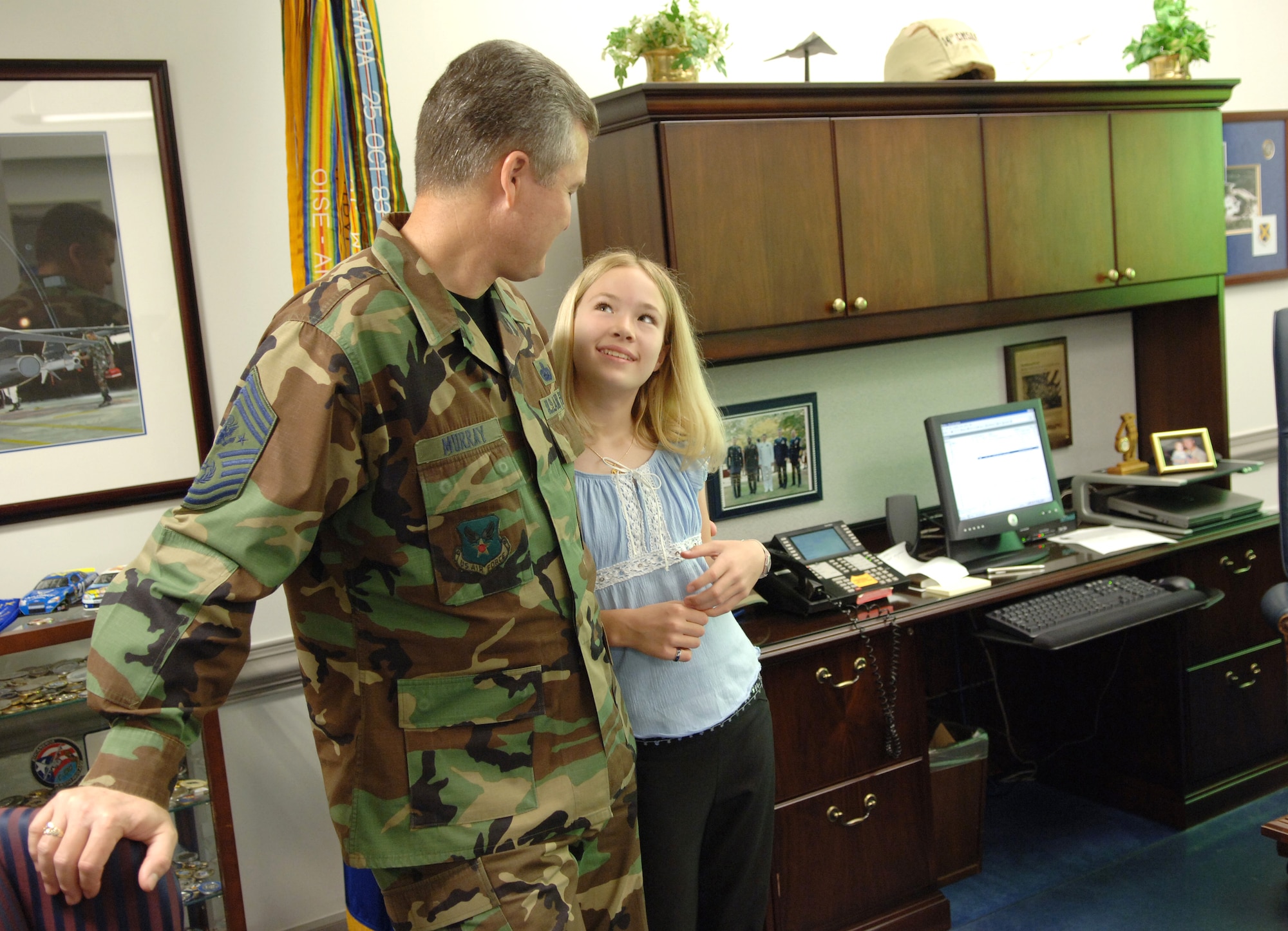Elizabeth Murray, 10, spends time with her dad, Chief Master Sgt. of the Air Force Gerald R. Murray, in his Pentagon office on Thursday, April 27, 2006. Chief Murray brought Elizabeth and his son Stephen to the Pentagon for the National Take Our Daughters and Sons to Work Day. (U.S. Air Force photo/Master Sgt. Jim Varhegyi) 
