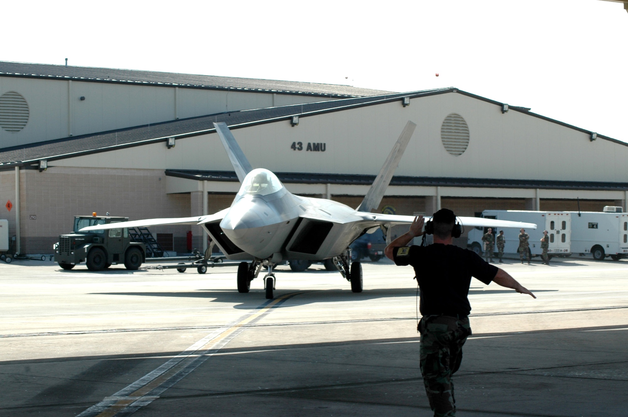 Tech. Sgt. Lewis Hale, marshals an F-22A Raptor, the new ground instructional trainer aircraft at the 43rd Fighter Squadron, at Tyndall Air Force Base, Fla., on Wednesday, April 19, 2006. Sergeant Hale is with the 325th Maintenance Operations Squadron. (U.S. Air Force photo/1st Lt. Jon Quinlan) 