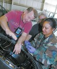 Joel Meyers, left, and Debra Wimberly, center, of the 419th Aircraft Maintenance Squadron, review standard maintenance practices with Tech. Sgt. Valorie Mathes, of the 388th Component Maintenance Squadron.