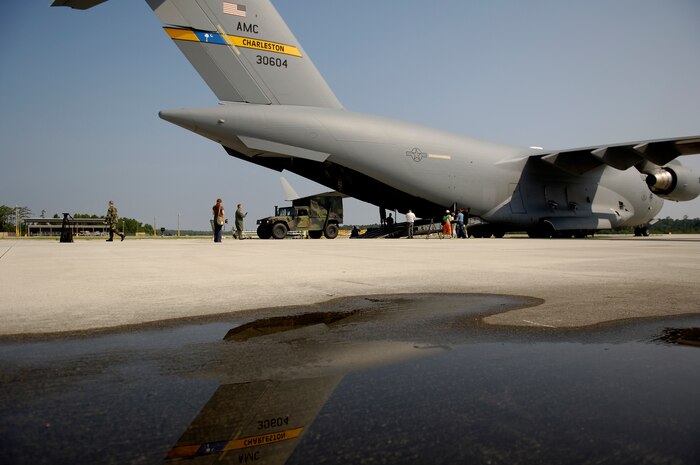 060720-F-2828D-080U.S. Air Force Staff Sgt. Terry Owen directs a tactical vehicle onto a C-17 Globemaster III at Marine Corps Air Station Cherry Point N.C. during Operation Iron Thunder, July 20, 2006. Sergeant Owens is a loadmaster with the 15th Airlift Squadron Charleston Air Force Base S.C. Operation Iron Thunder is a four day, large force operation consisting of more than 100 U.S., British, and NATO aircrafts simulating a full-scale invasion of the North Carolina coast. (U.S. Air Force photo by Tech. Sgt. Andy Dunaway) (Released)