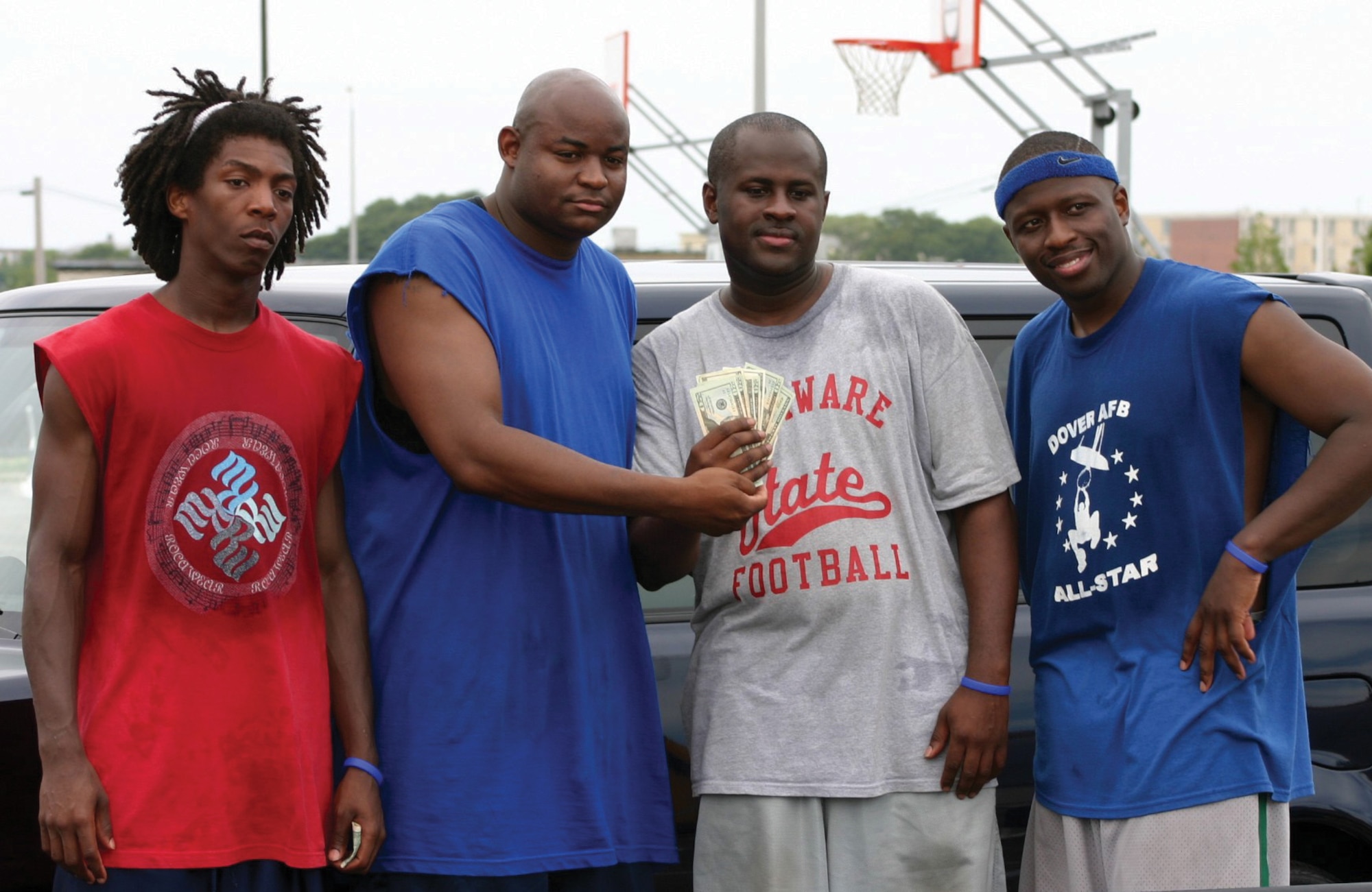 Left to right, Kolsum Ballard, spouse of Senior Airman Courtney Ballard with the 46th Aerial Port Squadron, Staff Sgt. John Saffold, 326th Airlift Squadron, Staff Sgt. Derek Whiteaff, 512th Component Maintenance Squadron, and Staff Sgt. Steve Hippolyte 436th Medical Group, placed second in an armed services basketball tournament July 15.