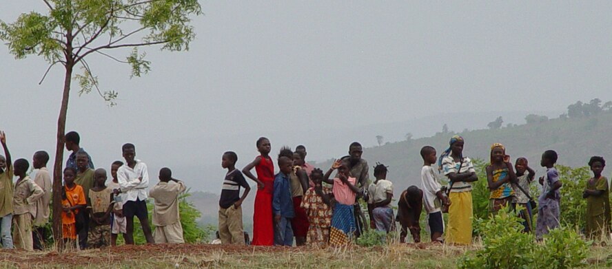 Approximately 200 local Malian civilians showed up at the landing zone to watch a display of military parachuting skills delivered by the Airmen of the 352nd Special Operations Group at Bamako, Mali June 14. U.S. Air Force, U.S. Army and Malian Army personnel took part in the last training event of the joint combined exchange training.  (U.S. Air Force photo by Master Sgt. Dennis Brewer)