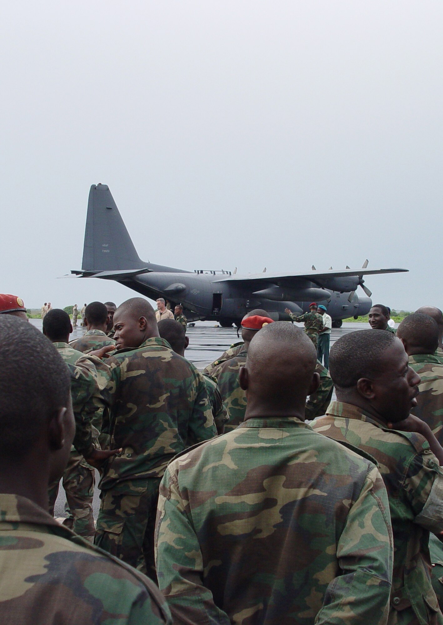 Malian parachutists gather in preparation to board a 352nd Special Operations Group MC-130H Combat Talon II, prior to the Friendship Drop June 14, which marked the last training event of the joint combined exchange training in Africa. (U.S. Air Force photo by Master Sgt. Dennis Brewer)