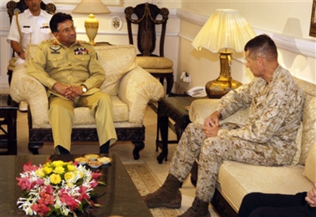 Chairman of the Joint Chiefs of Staff Gen. Peter Pace, U.S. Marine Corps, meets with Pakistan's President Gen. Pervez Musharraf in Islamabad, Pakistan, on July 28, 2006.  Pace is meeting with Musharraf to discuss regional defense issues and the war on terror. 