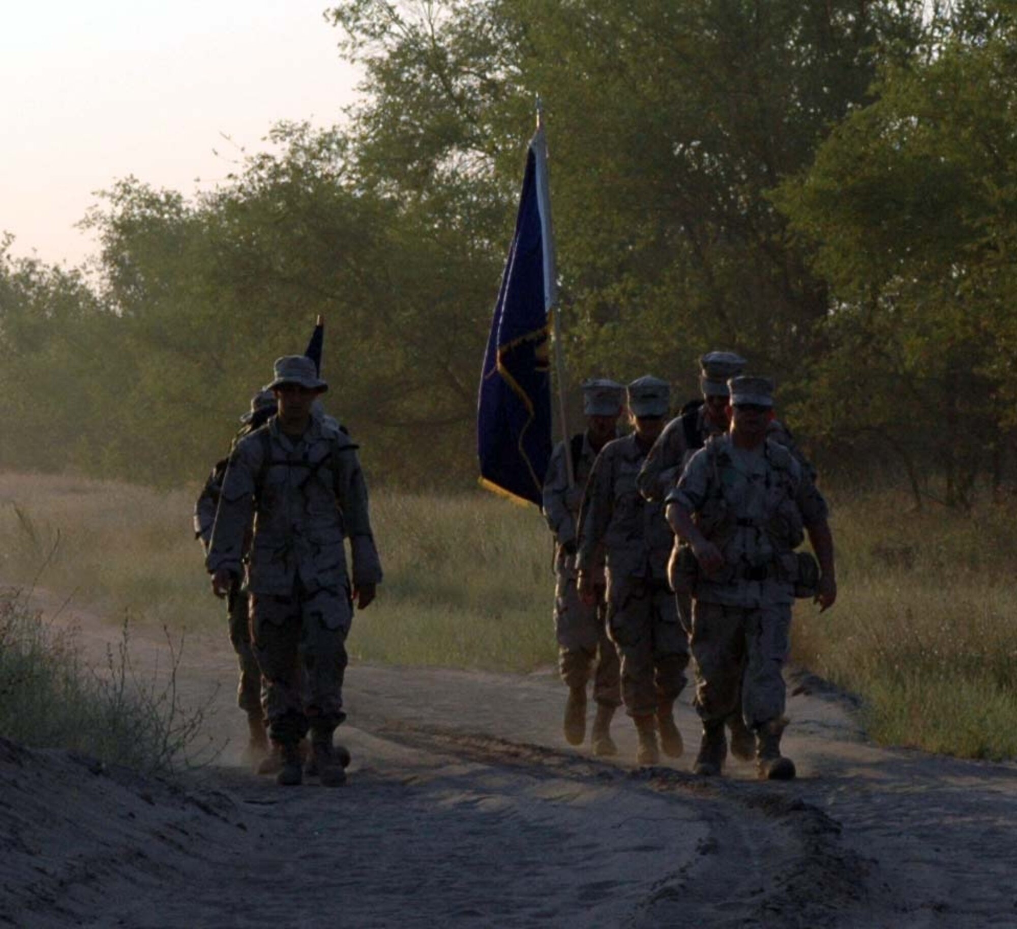 MANAS AIR BASE, Kyrgyzstan ?  Members of the 376th Air Expeditionary Wing  take part in a 15.5 mile walk during the early morning hours to commemorate the Nijmegen International Peace March, a four-day, 100-mile march held annually in Holland. Seventy-six servicemembers took part in the event. Air Force photo by Staff Sgt. Candy Knight 

