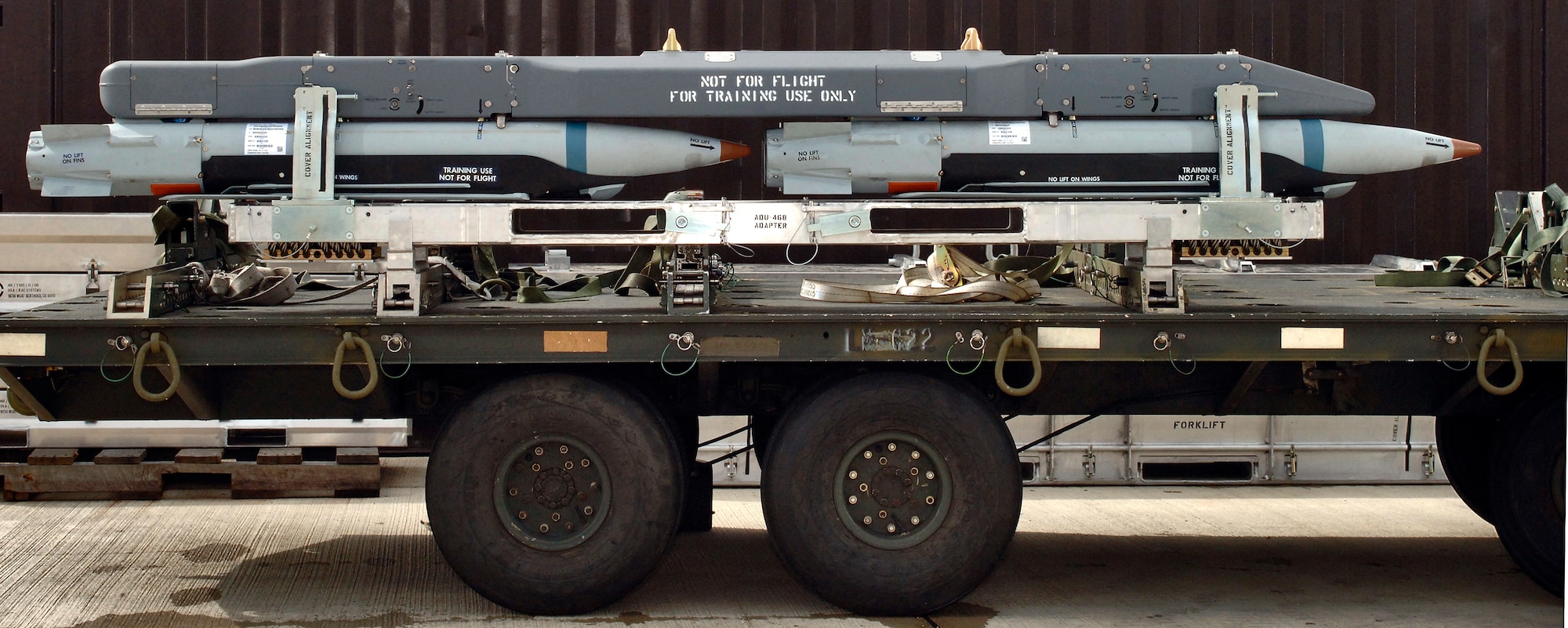 The Bomb Rack Unit 61 with carrier and four ground-training Guided Bomb Unit-39 small-diameter bombs on this munitions trailer undergoes testing at Royal Air Force Lakenheath, England, on Aug. 1. The 494th Fighter Wing will be the first unit to receive and use the bomb when it deploys to Southwest Asia later this year. (U.S. Air Force photo/Master Sgt. Lance Cheung) 