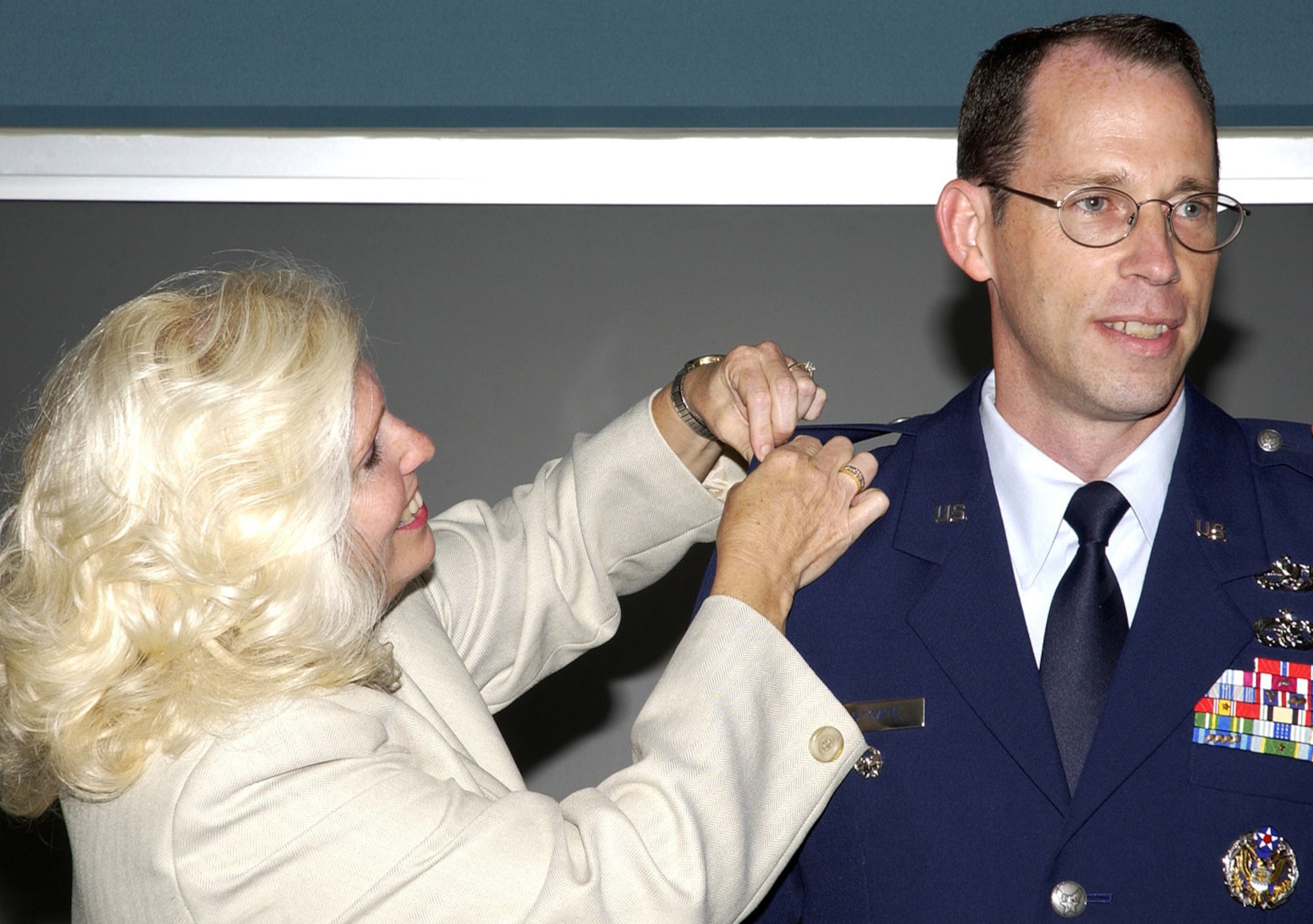 WRIGHT-PATTERSON AIR FORCE BASE, Ohio — Air Force Materiel Command executive director Barbara A. Westgate, a lieutenant general equivalent, pins the rank of colonel onto her husband, Lt. Col. Charles J. Westgate III, in what is believed to be the only such promotion of its kind to date in the Air Force. (Air Force photo by Michael Libecap)