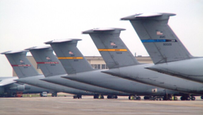 Patriot Wing C-5s get cozy on Westover's flightline with Galaxies from Dover AFB, Del., and Travis AFB, Calif. The C-5 is one of the largest aircraft in the world. The aircraft carries fully equipped combat-ready military units to any point in the world on short notice then provides field support required to help sustain the fighting force. Ground crews can load and off load the C-5 simultaneously at the front and rear cargo openings. The giant aircraft also makes its home at Altus AFB, Okla., Kelly AFB, Texas, Stewart ANG Base, N.Y., Wright-Patterson AFB, Ohio, and at the Tennessee ANG in Memphis. 