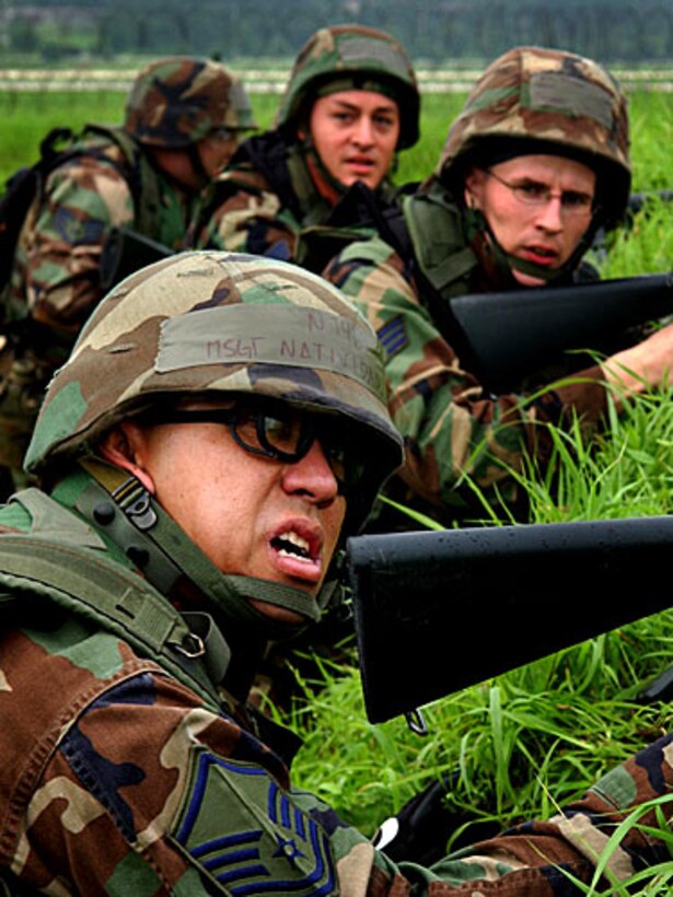 U.S. Air Force security forces airmen take cover during a simulated attack as part of an exercise at Osan Air Base, South Korea, July 23, 2006. 