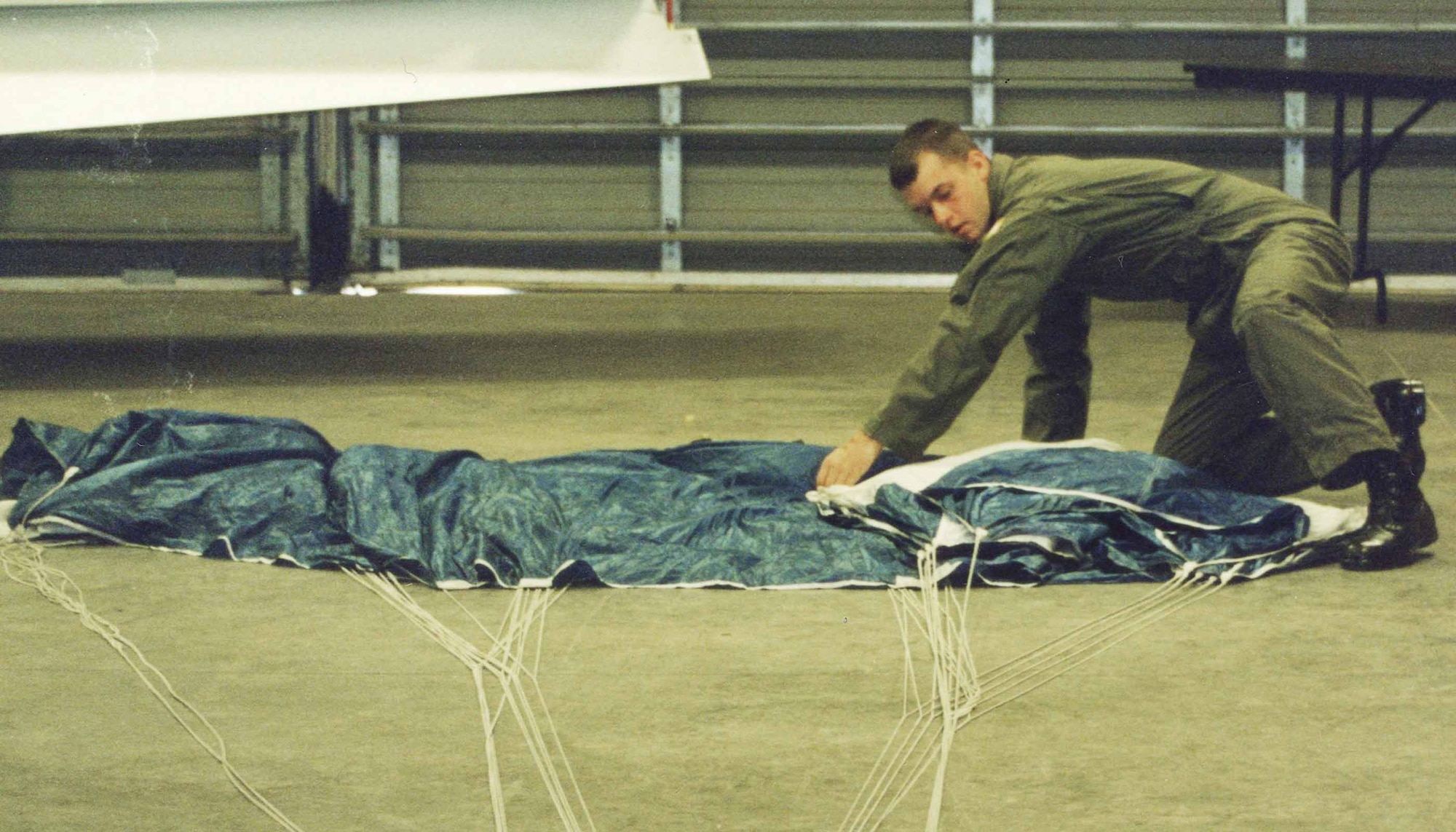 Airman 1st Class Trey Williams, 20th Medical Support Squadron, packs his parachute prior to a skydiving jump at the academy. (Courtesy photo)