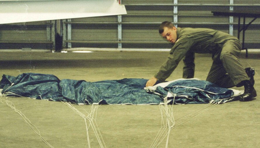 Airman 1st Class Trey Williams, 20th Medical Support Squadron, packs his parachute prior to a skydiving jump at the academy. (Courtesy photo)