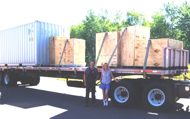 ODANAH, Wisc -- Dr. Dennis Sullivan and Becky Melerotto, registered nurse, in front of a semi-trailer loaded with medical supplies.  The supplies were sent to the Mad River Tribal Clinic as part of the TRANSAM program. (Courtesy photo)