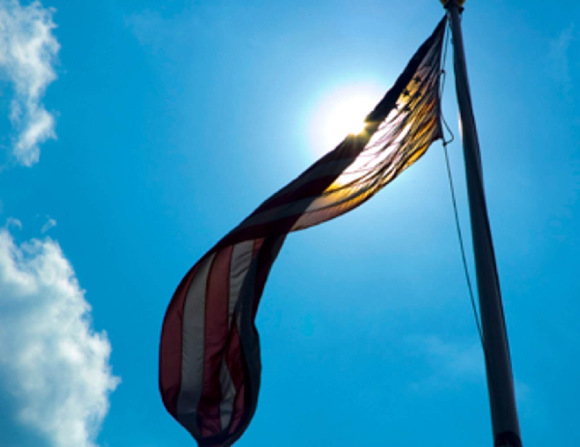 Base Airmen and civilians would've wrapped themselves in the flag Wednesday--or anything else they could find to shield them from the searing, mid-day sun as temperatures here hovered at 100 degrees. Although the thermometer stopped one degree short of Massachusetts' 54-year-old mark for the hottest day on record, the oppressive conditions prompted base officials to declare a "Black Flag" heat condition, which limits outdoor activities to critical missions. Even then, workers must follow the 20/40 rule--40 minutes rest for every 20 minutes of work--and consume 1-2 quarts of water every hour.