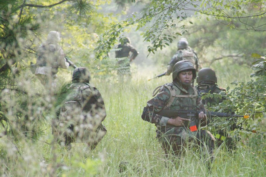 Senior Airman Tikiria Knowles, 20th Operations Support Squadron air traffic controller, receives training from 20th Security Forces personnel July 26. The training is designed to prepare deploying Shaw members who may encounter combat situations. (U.S. Air Force photo/Tarsha Storey)