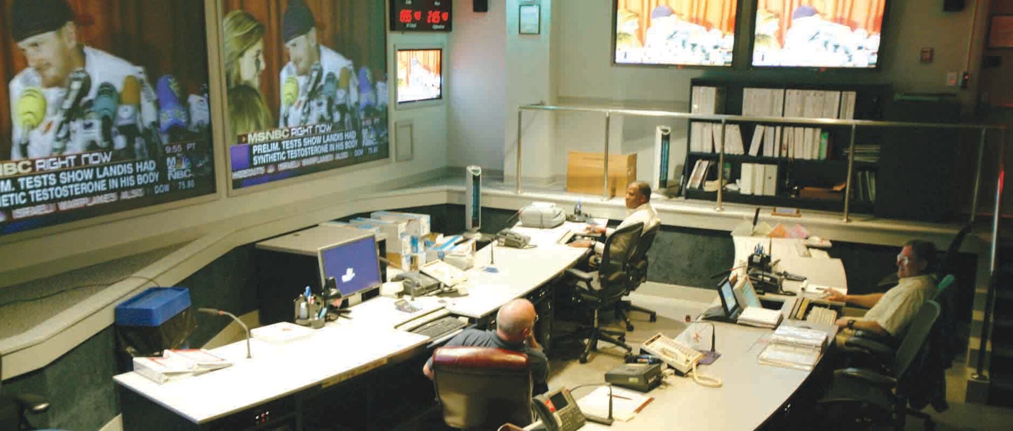 Jay Motyl, Central Air Forces Operations Center deputy director, Dan Spivey and Timothy Gibson, COC military analysts, monitor real-world situations that may impact operations.  (U.S. Air Force photo/Senior Airman John Gordinier)