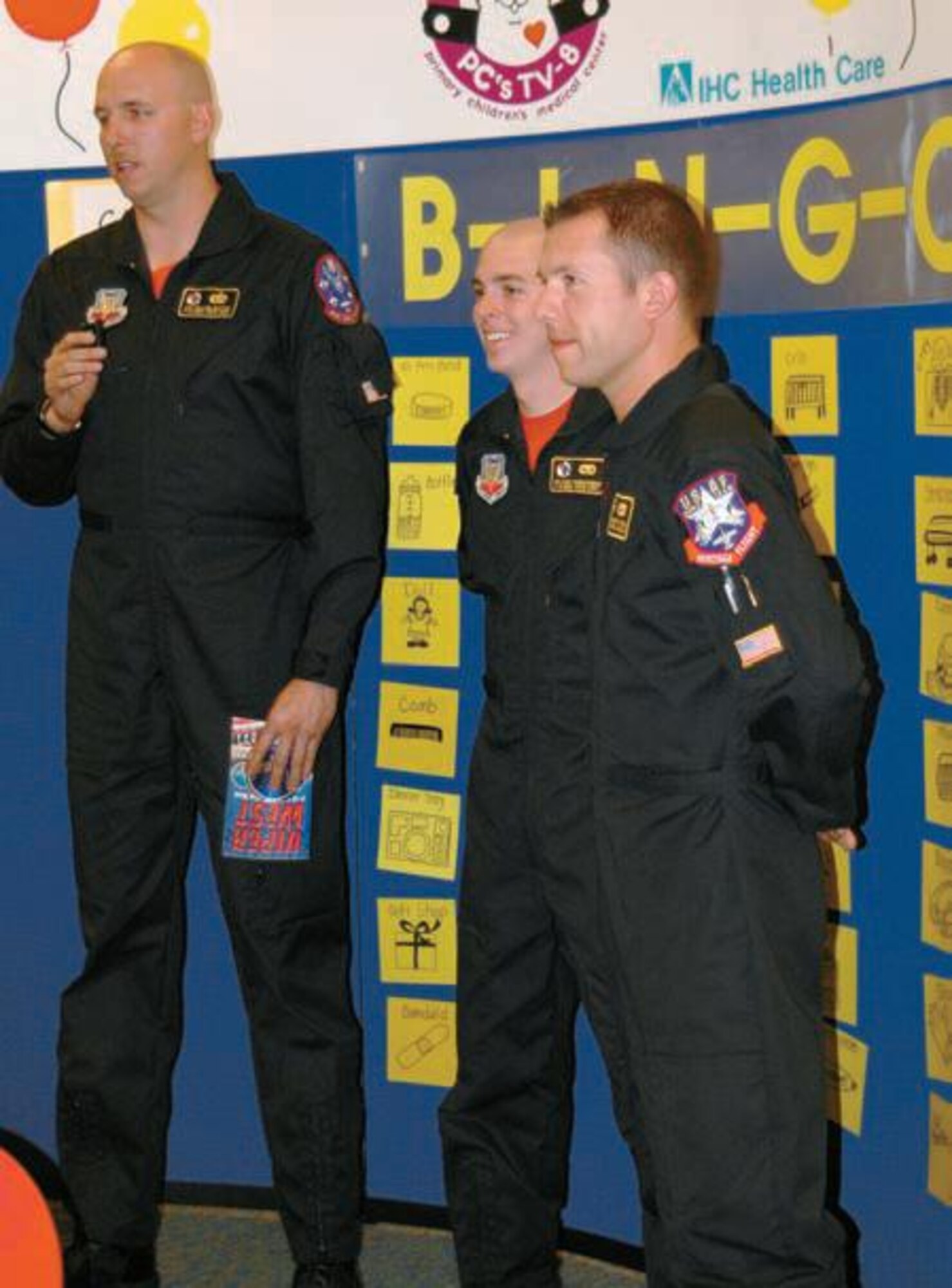 (Left to right) Staff Sgt. William Griffith, Senior
Airmen Mark Vandevender and Kenneth Umeck,
with the Viper West demo team, speak to 150 kids
via a television link during a Bingo game March 15
at Primary Children?s Medical Center.