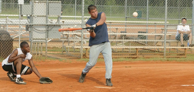 Staff Sgt. Jeremy Witmer, 20th Component Maintenance Squadron, swings and hits a double during an intramural softball playoff game against the 20th Equipment Maintenance Squadron Monday.  (U.S. Air Force photo/Senior Airman John Gordinier)