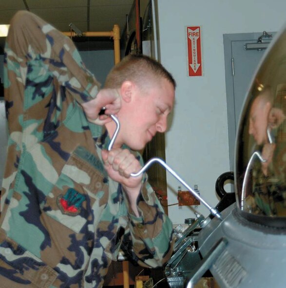 Senior Airman Andrew Hanson, a 388th CMS Egress Aircrew journeyman, removes
a rainseal panel to have access for an inspection of a seat.