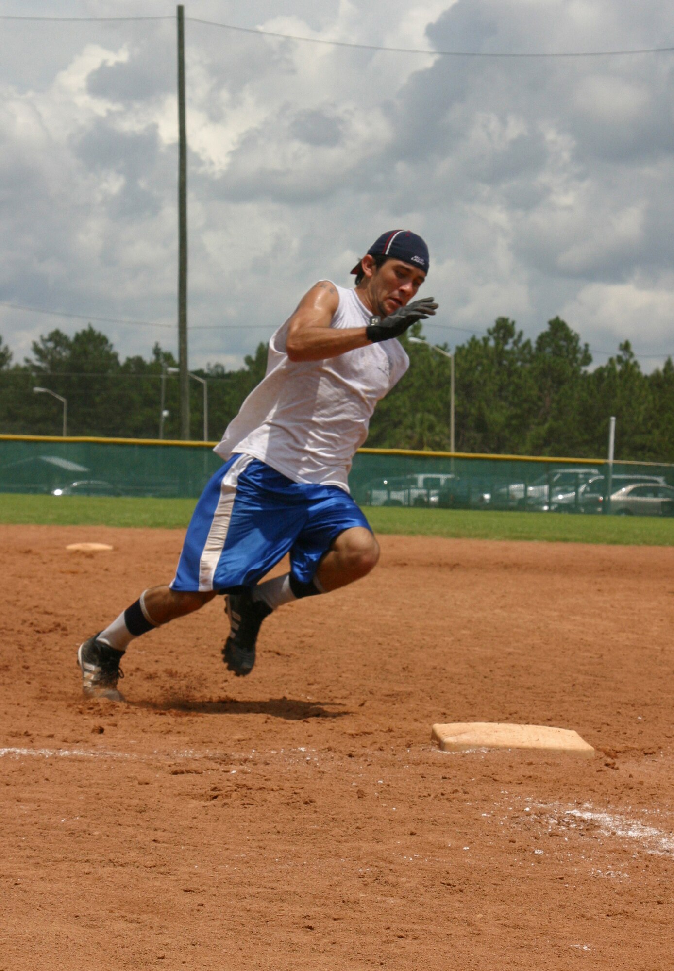 Andru Jimenez speeds through all the bases as the fastest base runner on the team. While on the tail of teamates, he had to push them to homeplate. (U.S. Air Force photo\Senior Airman Cassandra Locke)