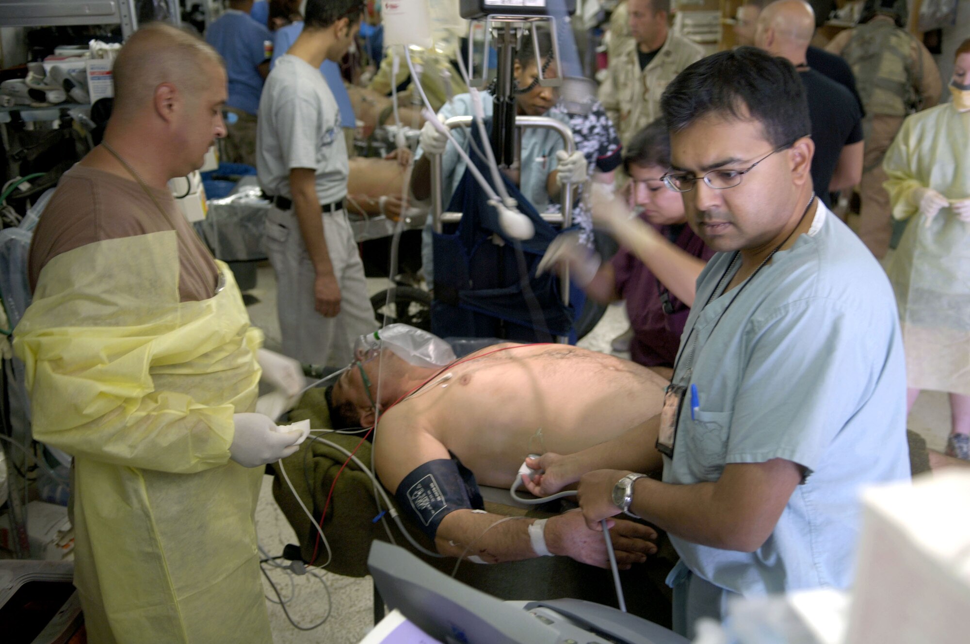 Medics from the Air Force Theater Hospital treat emergency room patients at Balad Air Base, Iraq, on Aug. 2. The hospital provides Level 1 trauma and specialized medical care. (U.S. Air Force photo/Airman 1st Class Andrew Oquendo) 
