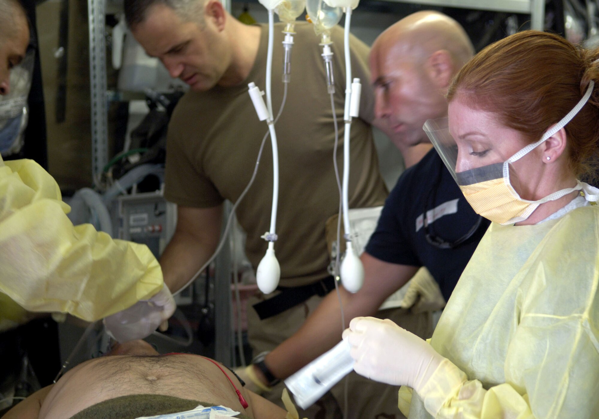Medics from the Air Force Theater Hospital treat emergency room patients at Balad Air Base, Iraq, on Aug. 2. The hospital provides Level 1 trauma and specialized medical care. (U.S. Air Force photo/Airman 1st Class Andrew Oquendo) 

