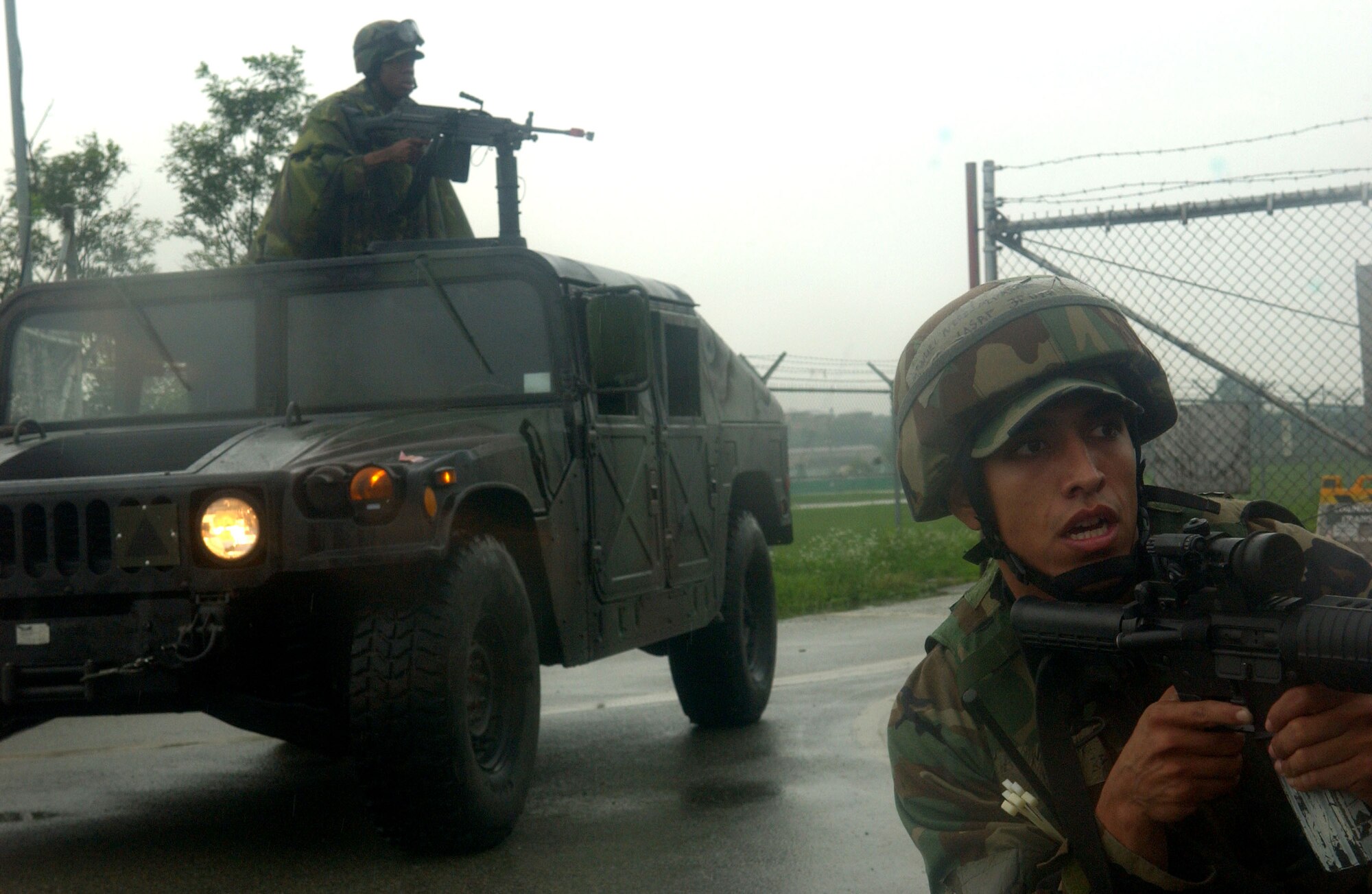 Security forces Airmen wait for "opposing forces" during Exercise Beverly Bulldog at Osan Air Base, South Korea, on July 28. (U.S. Air Force photo/Airman 1st Class Chad Strohmeyer)