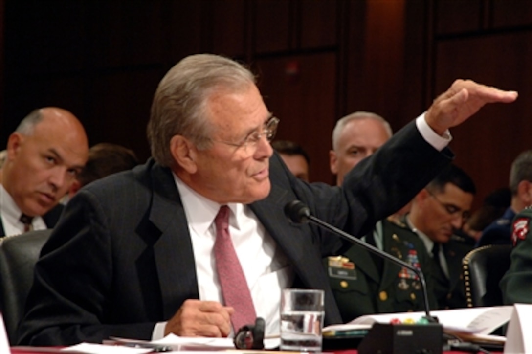 Secretary of Defense Donald H. Rumsfeld gestures to make his point as he testifies to the Senate Armed Services Committee on Iraq, Afghanistan and the war on terror during a hearing on Capitol Hill in Washington, D.C., on Aug. 3, 2006.  Chairman of the Joint Chiefs of Staff Gen. Peter Pace, U.S. Marine Corps, and Commander, U.S. Central Command, Gen. John Abizaid, U.S. Army, joined Rumsfeld for the testimony.  