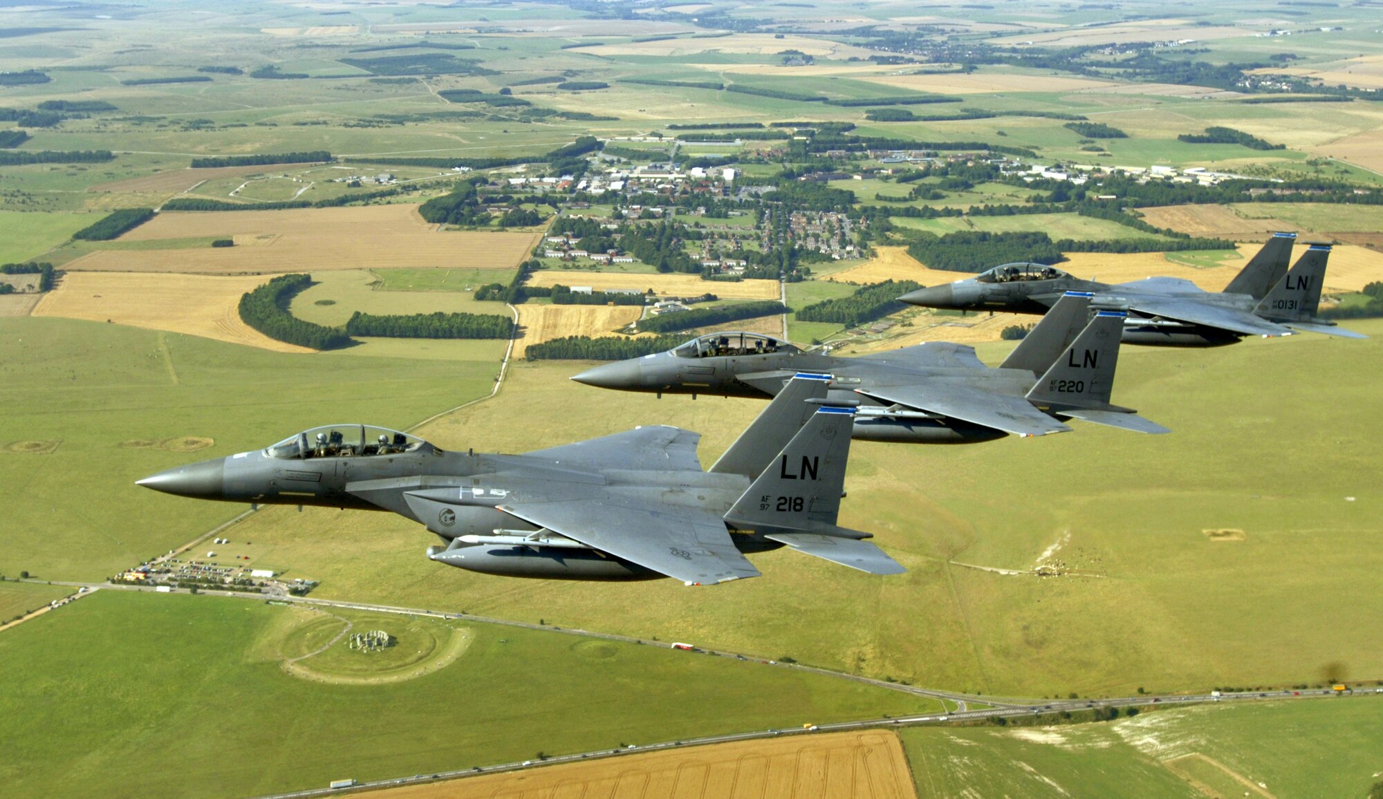 A trio of F-15E Strike Eagles from the 492nd Fighter Squadron at Royal Air Force Lakenheath, England, flies past Stonehenge on Thursday, Aug. 3. The fighters were on their way to an area off the southwestern coast of England to practice basic surface attack techniques.  (U.S. Air Force photo/Master Sgt. Lance Cheung)